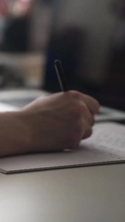 Man journaling thoughts into notebook Stock Footage 304091307