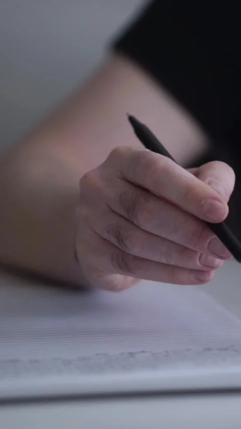 Man journaling thoughts into notebook Video stock 304092271