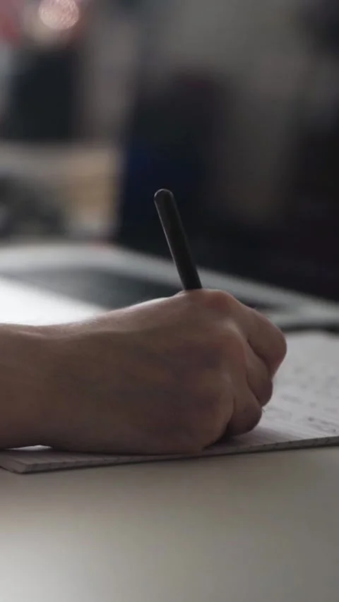 Man journaling thoughts into notebook Stock Footage 304094165