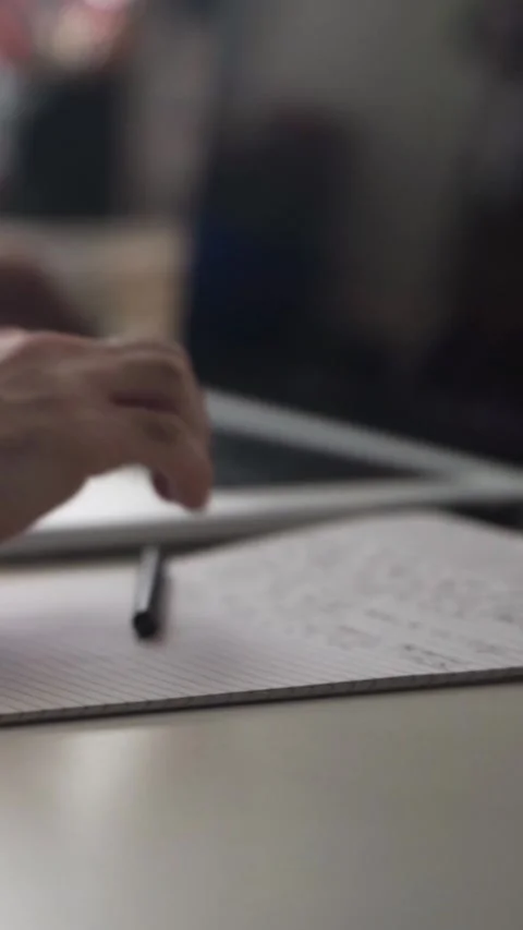 Man journaling thoughts into notebook Видео 304094449