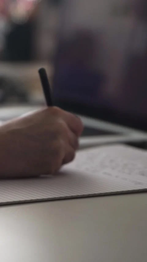 Man journaling thoughts into notebook Video stock 304096416