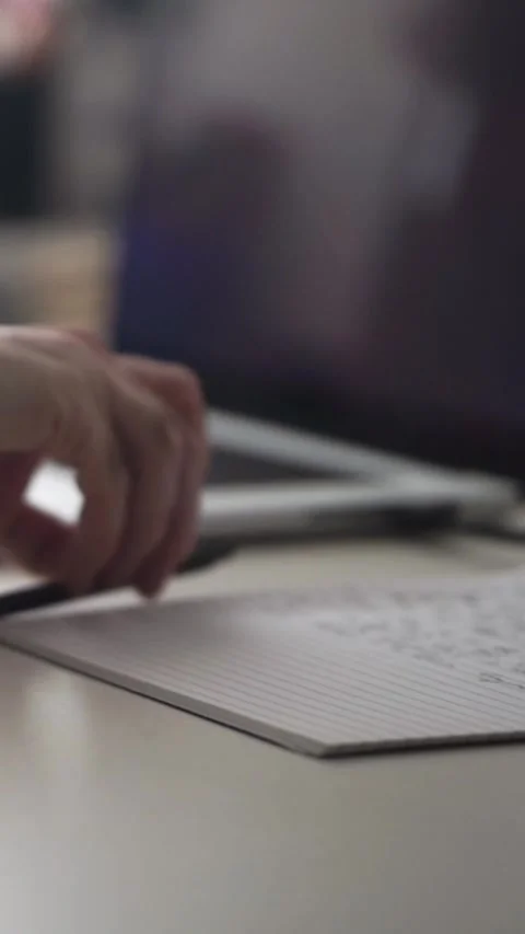 Man journaling thoughts into notebook Stock Footage 304113009