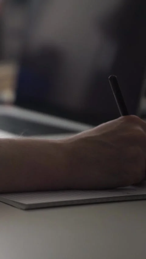 Man journaling thoughts into notebook Stock Footage 304113234