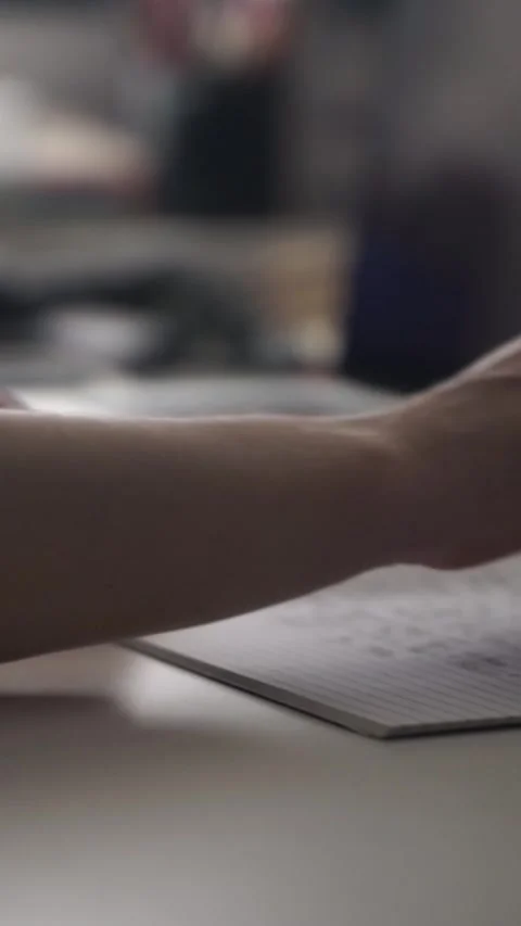 Man journaling thoughts into notebook Stock Footage 304114497