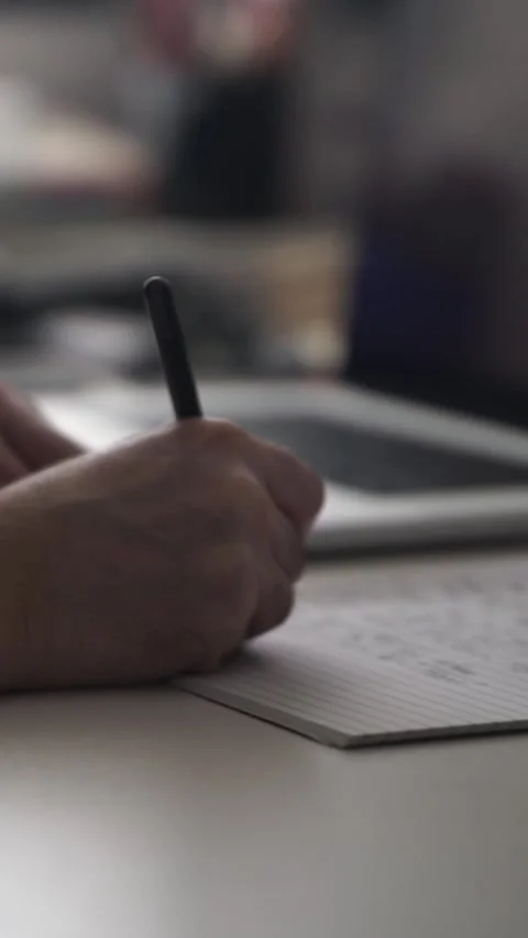 Man journaling thoughts into notebook Stock-Footage 304114507