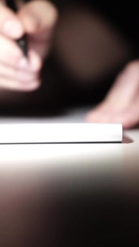 Man journaling thoughts into notebook Видео 304114517