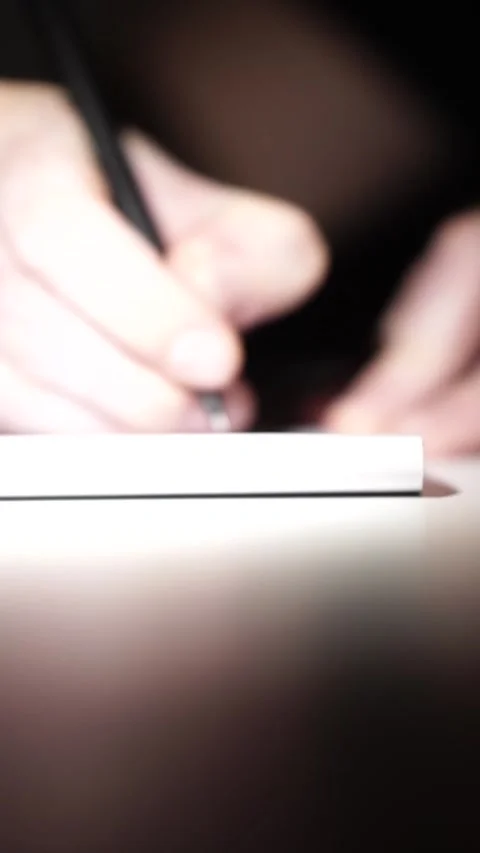 Man journaling thoughts into notebook Stock-Footage 304114522