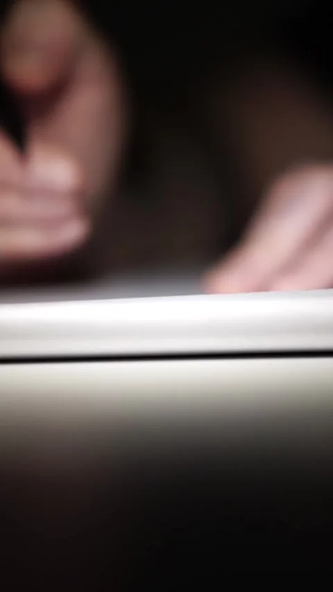 Man journaling thoughts into notebook Stockbeeldmateriaal 304115540