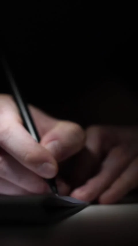 Man journaling thoughts into notebook Video stock 304115849