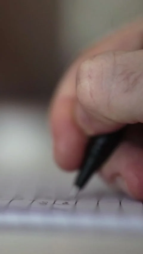 Man journaling thoughts into notebook Stock Footage 304116125