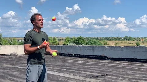 Man juggles Stock Footage 113017633