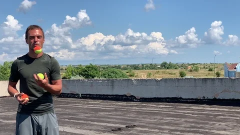 Man juggles Stock Footage 113017640