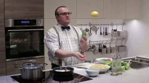 A man juggles vegetables Stock Footage 62745096