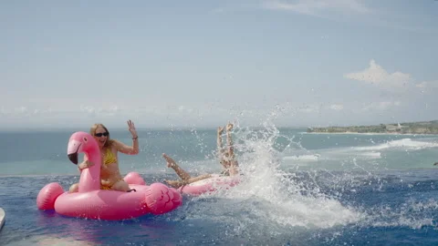 Man jump in infinity swimming pool with water splash, passion woman swim Stock Footage 269112570