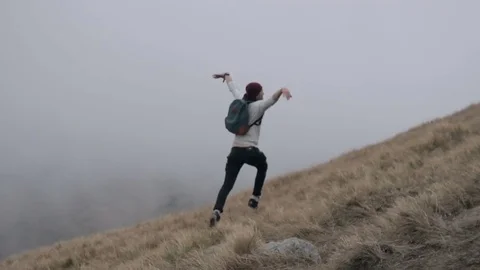 Man jump at mountain Stock Footage 73191296