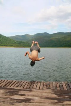 A man jump to river Stock Photos