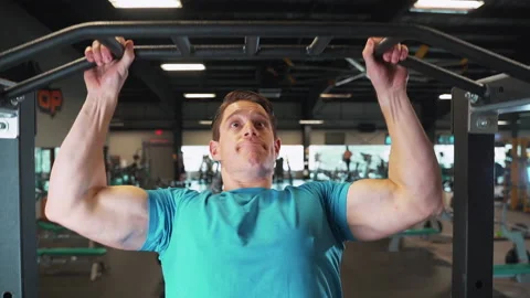 Man Jumping Up and Doing A Pull Up At Gym | Slow Motion Stock Footage 167285016