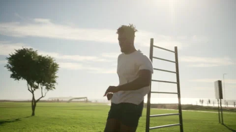 Man jumping and warming up outside Stock Footage 279310191