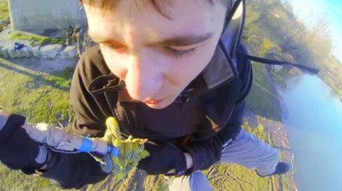 Man jumping backwards off a bridge from Gopro  Hero 3 Stock Footage 52431157