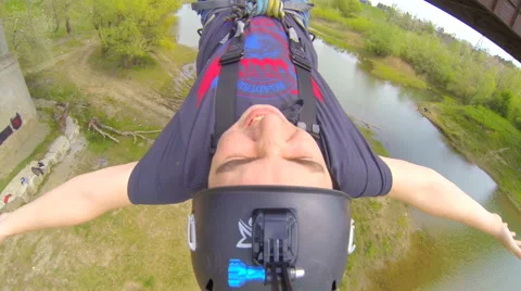 Man jumping backwards waving hands Stock Footage 47816174