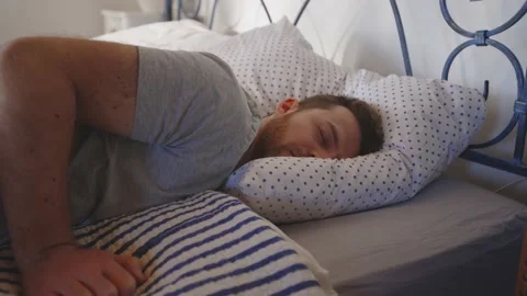 Man Jumping in Bed Resting Relaxing Sleeping Bed Day Time Mental Health 스톡 동영상 195287491