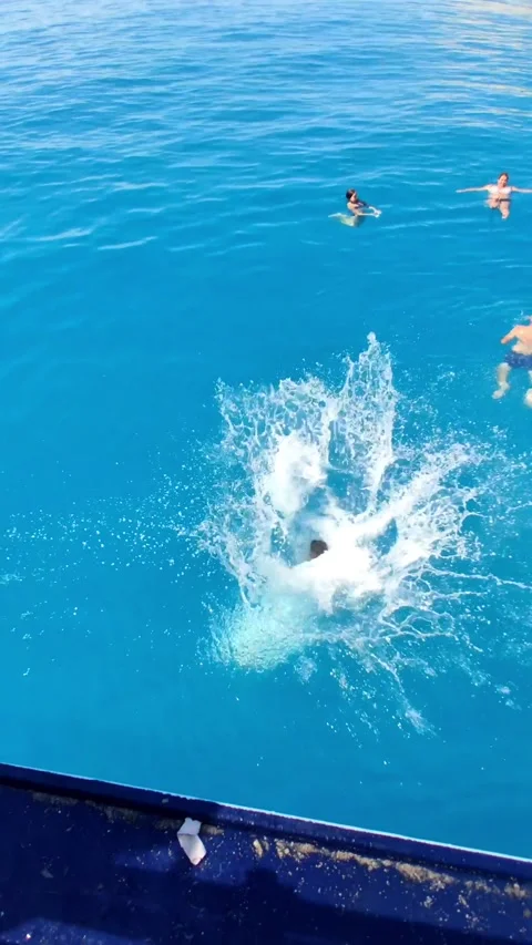 Man jumping from the boat to the sea Stock Footage 166409992