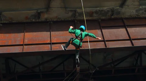 Man jumping off a bridge backwards Stock Footage 37220701