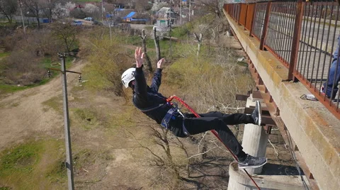 A man jumping from the bridge backwards Stock Footage 68347141