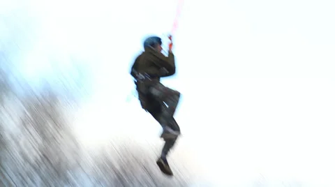 Man jumping off a bridge with a backwards somersault Stock Footage 34012927