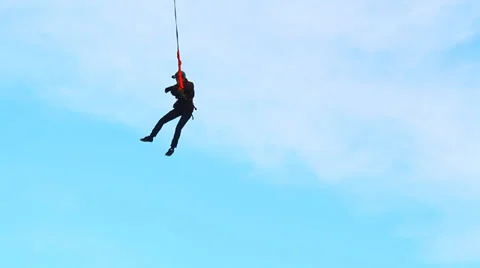Man jumping from the bridge facing forward somersault with Stock Footage 34013078