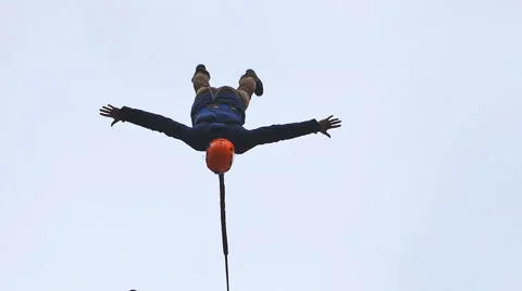 Man jumping from the bridge facing forward with the coup Stock Footage 49921474