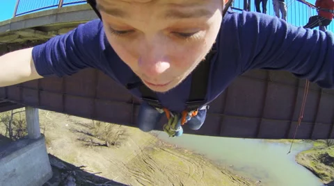 A man jumping from the bridge facing forward Stock Footage 52429682