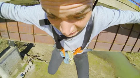 Man jumping from the bridge facing forward your arms Stock Footage 52429770