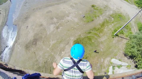 Man jumping from the bridge facing forward Stock Footage 53350648