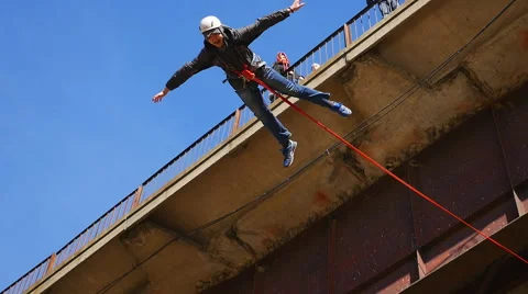 A man jumping from the bridge facing forward flat Stock Footage 57640188