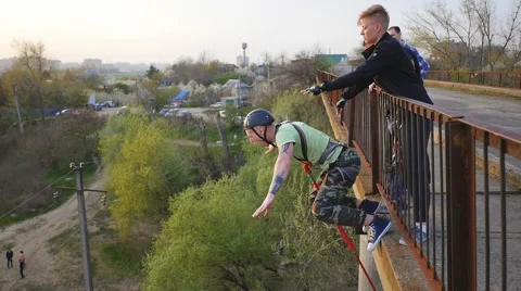 A man jumping from the bridge facing forward Stock Footage 68349651