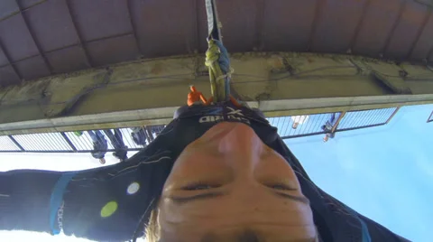 Man jumping off a bridge in front of face Stock Footage 37726247