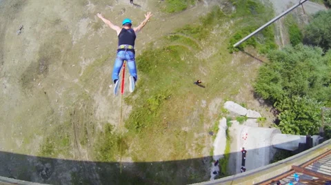 Man jumping off the bridge, head first with the coup Stock Footage 53350842