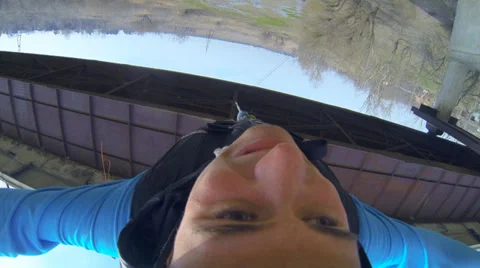 Man jumping off a bridge headfirst Stock Footage 37726510