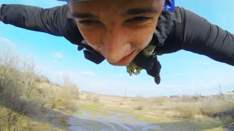 Man jumping off a bridge on his face all the emotions Stock Footage 53348690