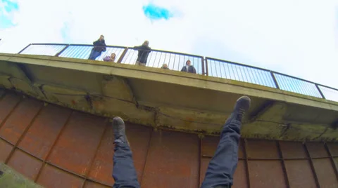 A man jumping off a bridge Shooting is the first person camera Gopro Hero 3 Stock Footage 33841294
