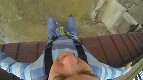 Man jumping from the bridge upside down Stock Footage 36553284