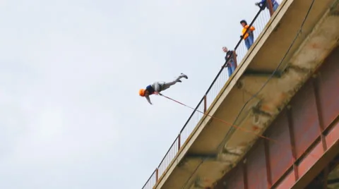 Man jumping from the bridge waving hands Stock Footage 49922951