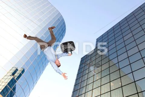 Man jumping off building Stock Photos