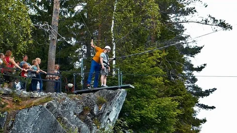 Man Jumping From the Cliff With Bungee Rope Stock Footage 72354765