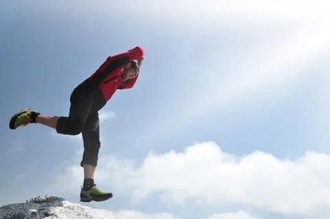 Man jumping from a cliff Stock-Fotos