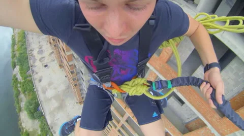 Man jumping facing forward and shouts Stock Footage 48354430