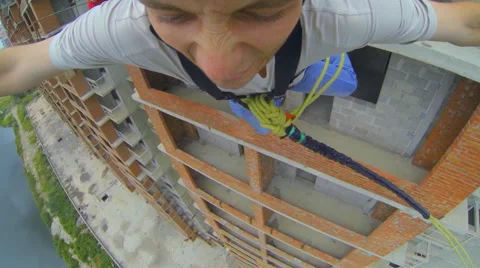 Man jumping facing forward and takes a deep breath in fear Stock Footage 48358256