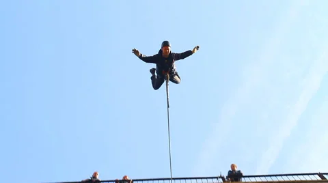 Man jumping headfirst with arms and legs apart Stock Footage 37220396