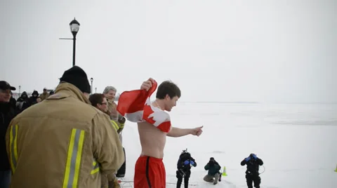 Man Jumping Into Icy Water With Canada Flag Stock Footage 35697331